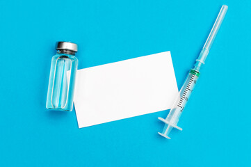 Blank card with vaccine vial and syringe. Space for text.