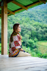 Asian Woman in Thai Native Pavilion with Rice Field Background at Pa Bong Piang Rice Terraces