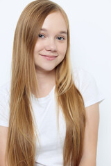 Fototapeta premium cute little girl with blond hair white t-shirt close-up