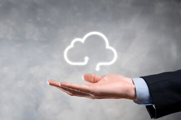 Businessman hold cloud icon.Cloud computing concept - connect smart phone to cloud. computing network information technologist with smart phone.Big data Concept.