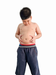 Fat boy holding hands on belly on isolated white background.