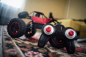 Remote control car on the floor of living room. © Natali