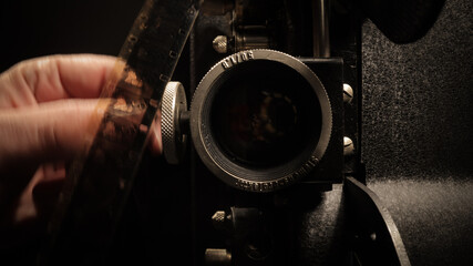 Inserting the film into an old film projector - macro shot