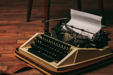 retro typewriter with keys letters wooden background white sheet of paper newspaper