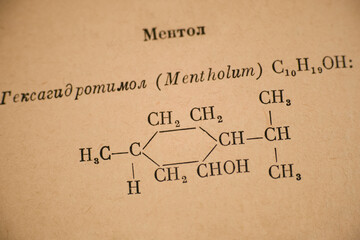 Page of old Russian chemistry book with chemical formula of Menthol.