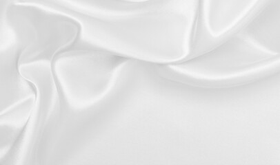 Smooth elegant white silk or satin luxury cloth texture as wedding background. Luxurious background design