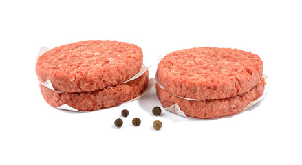 Raw beef patties for making a burger.Isolated on a white background.Selective Focus.