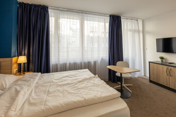 Fototapeta premium Bedroom interior in hotel apartment