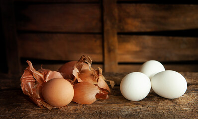 Onion shell prepared for coloring white eggs for Easter celebration