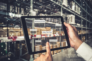 Smart warehouse management system using augmented reality technology to identify package picking and delivery . Future concept of supply chain and logistic business .