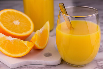 Orange juice in a glass on a white background. Close-up.	