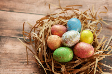 Colorful easter eggs on wooden background. . Happy Easter background.
