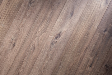 Laminated wooden floor surface background or wall texture.  Brown wood laminate floor