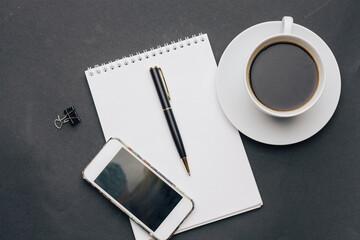 work desk notepad with pen drink cup phone technology