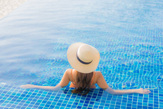 Portrait beautiful young asian woman relax smile leisure around outdoor swimming pool - Powered by Adobe