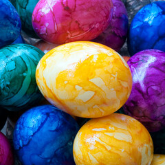 A pile of colorful easter eggs on a market