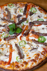 close-up mixed pizza with meat