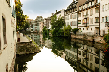 Strasbourg, France, August 2019. The historic center offers the view of pleasant and relaxing glimpse: the characteristic period houses are reflected on the water mirror of the canals.