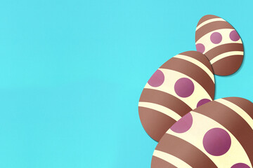 Easter eggs on light blue background. Colorful. Paper texture. Illustration.