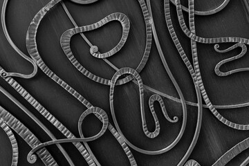 Beautiful forged elements of a metal gate. Home protection. A sense of security