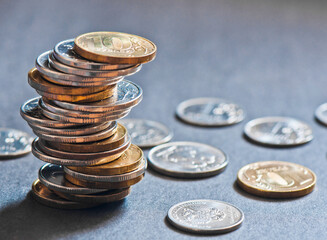 Money. Stack of russian roubles coins, gray background
