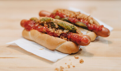 sandwich on a wooden table and boiled sausages pan cooking hot dog