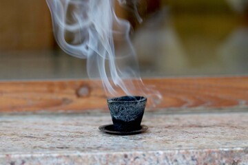 Dhoop wooden stick is burned to produce a pleasant smell for part of a religious ceremony in (Hindu) India