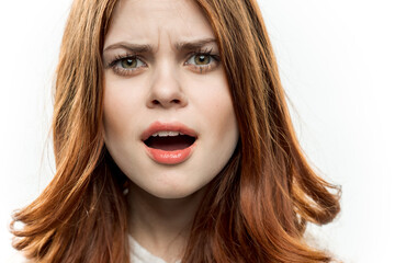 pretty surprised woman red hair face closeup emotions