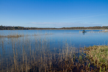 Calm lake with pier.