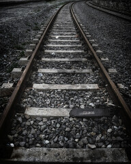 railway on pebbles in dark tones