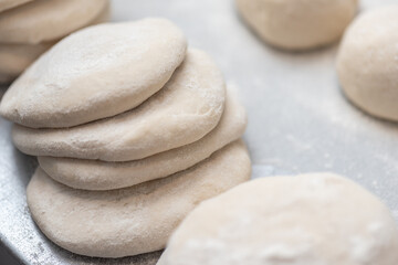 Fototapeta na wymiar pastry, dough, bakery, puff, food, white, healthy, raw, ingredient, fresh, closeup, sweet, organic, vegetarian, nutrition, group, macro, health, raw, background, bread, pin, recipe, rolling, baking, 