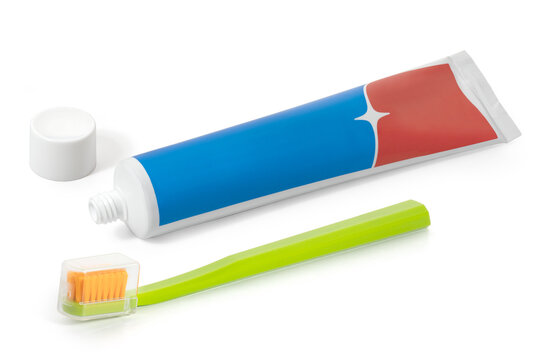 A Tube Of Red And Blue Toothpaste And A Toothbrush On A White Background. Full Depth Of Field. With Clipping Path.