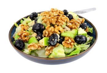 Waldorf salad with walnuts, celery, apples and grapes isolated on a white background