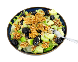 Waldorf salad with walnuts, celery, apples and grapes isolated on a white background