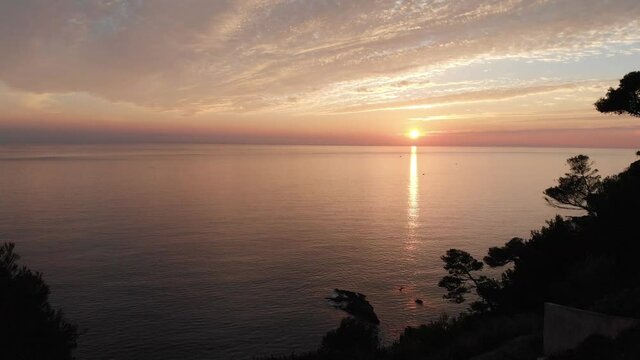 Aerial shot by drone of the sunset by the sea on the French Riviera. sanary, var, France