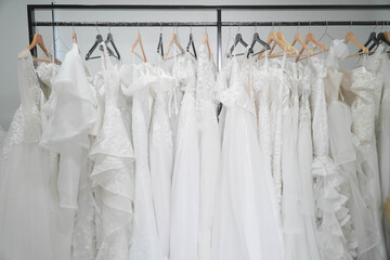 Wedding dresses hanging on a hanger. Fashion look.Beautiful bridal dress on hangers
