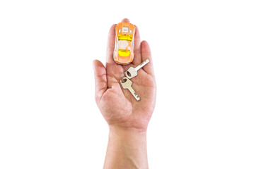 Toy car and keys on the palm isolated on white background. View from above.