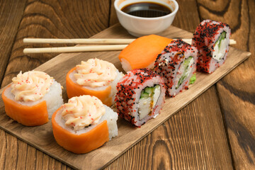 sushi roll on a plate with chopsticks. view from above