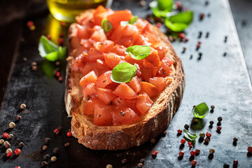 Tasty bruschetta with fresh tomato for snack. Italian cuisine.