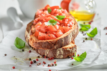 Crisp bruschetta with fresh tomato for snack. Italian cuisine.