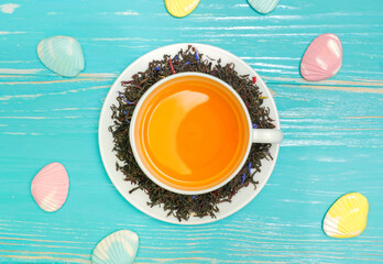 High resolution photo: Cup with tea , around brew and sweet-stuff