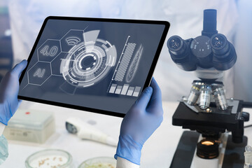 A tablet with infographics in the hands of a scientist. Grain analysis in the laboratory. Technologies.