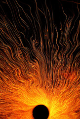 Abstract circle flame sparks or Black hole concept. Vertical background or wallpaper with copy...