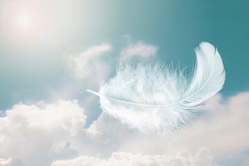 Beautiful Soft and Light Fluffy White Feathers Floating inThe Sky with Clouds. Abstract. Heavenly dreamy fluffy colorful sky.