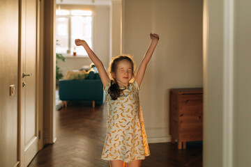 arly in the morning, the girl with closed eyes woke up and stretches. Good morning and get up!