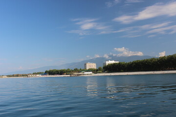 Fototapeta premium Small marina, beach, hotel and mountains