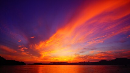 Fototapeta na wymiar 島の真っ赤な夕焼け