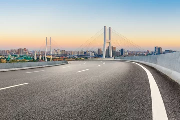 Cercles muraux Pont de Nanpu Asphalt highway and city skyline with bridge at dusk in Shanghai,China.