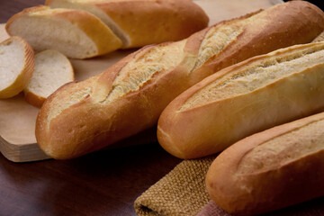 French baguettes on the table close-up stock images. Pile of french bread still life stock photo. Fresh baguettes detail images