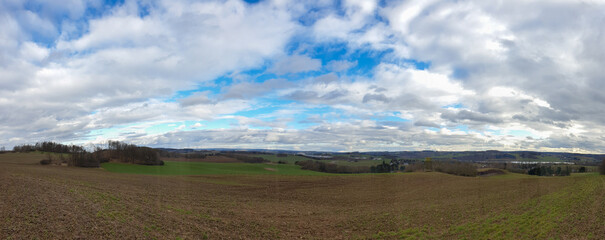 scenic panorama view of natural landscape under a cloudy sky